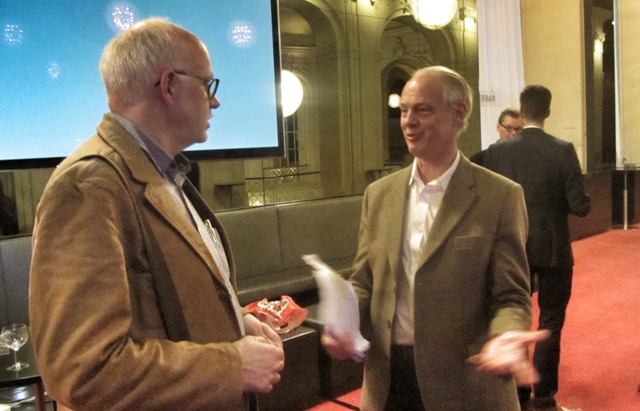 Richard Norton (r) talking to researcher Thomas Krebs from Switzerland at the Operetta Symposium of the Komische Oper.