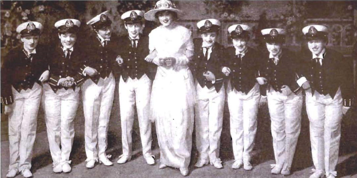 Elaine sings and dances with a chorus of British midshipmen, who are actually women. (Photo: VHRPLive!)