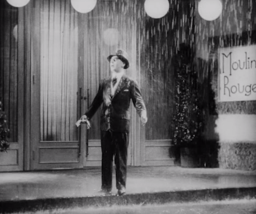 Fritz Schulz  as Bobby doing a "Singing in the Rain" scene. (Photo: Screenshot)
