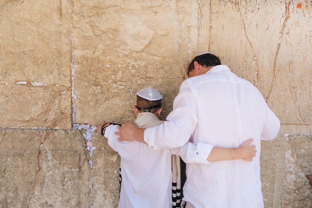 Two men praying in Jerusalem at the Western Wall. (Photo: Anton Mislawsky)