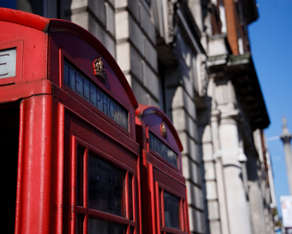 Two telephone boxes on Trafalgar Square, around the corner from ENO. (Photo: Damian Kamp / Unsplash)