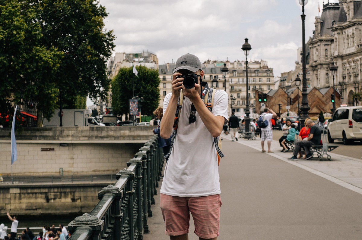 A photographer in the streets of Paris today. (Photo: Alicia Steels / Unsplash)